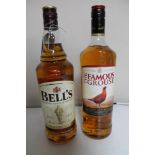 Two bottles of whisky - Bells blended scotch 1l and The famous grouse 1l.