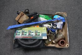 A box containing fishing reel, fishing hooks,