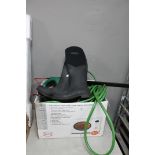 A box containing hose pipe, pair of boots,