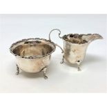 A shaped silver sugar bowl and matching cream jug,