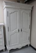 A painted double door classical style wardrobe CONDITION REPORT: 126cm wide by 60cm