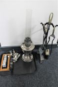 A metal fire tidy, oil lamp,