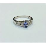 A 14ct white gold tanzanite and diamond ring, size N. CONDITION REPORT: 2.8g.