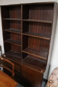 A mid 20th century Danish bookcase with cupboards beneath