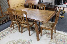 A Barker & Stonehouse granite inlaid dining table and five rush seated chairs