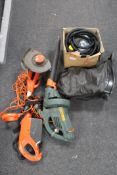 An electric garden vacuum together with a strimmer