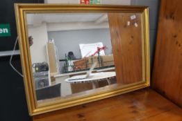 A gilt framed mirror