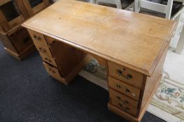 An Edwardian pine pedestal desk