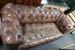 An antique brown buttoned leather Chesterfield three seater settee CONDITION REPORT: