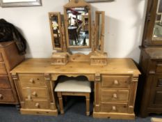 A pine mirror back dressing table and stool