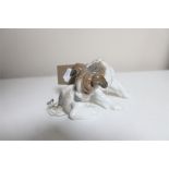 A Lladro figure - puppy with butterfly on tail