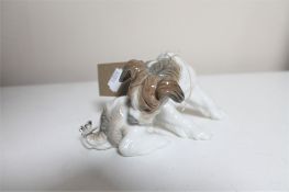 A Lladro figure - puppy with butterfly on tail