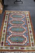 A Caucasian rug of polychrome geometric design,