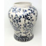 A decorative blue & white glazed ware pot, with blossom bough decoration, by India Jane of London,