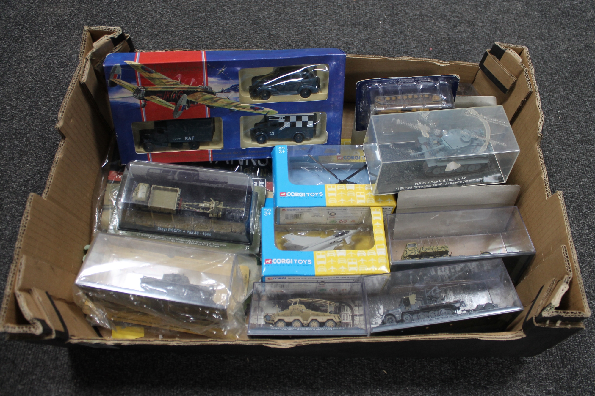 A box of die cast vehicles, military tanks,