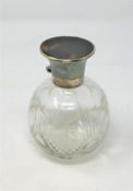 A spherical glass perfume bottle, with cut and etched decoration,