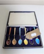 A set of six silver gilt enamelled teaspoons