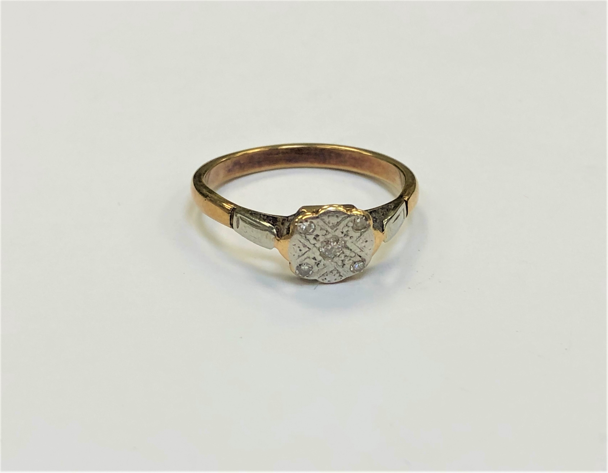 A yellow metal diamond set ring, apparently unmarked, size O CONDITION REPORT: 2.