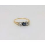 A yellow gold two stone diamond and sapphire ring,