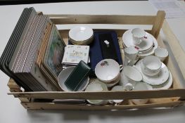 A crate of tea china, place settings,