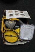 A box of site light and Karcher pressure washer