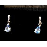 A pair of white gold diamond and blue topaz drop earrings