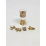 A quantity of dental gold (13.6g), together with a further glass vial containing dental gold.