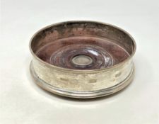 A modern silver wine bottle coaster, London marks,