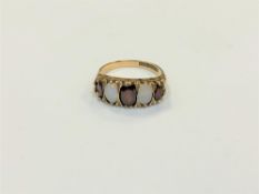 A 9ct gold opal and garnet ring,