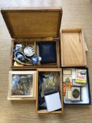 A group of collectables including military badges, matchbooks, wristwatch,