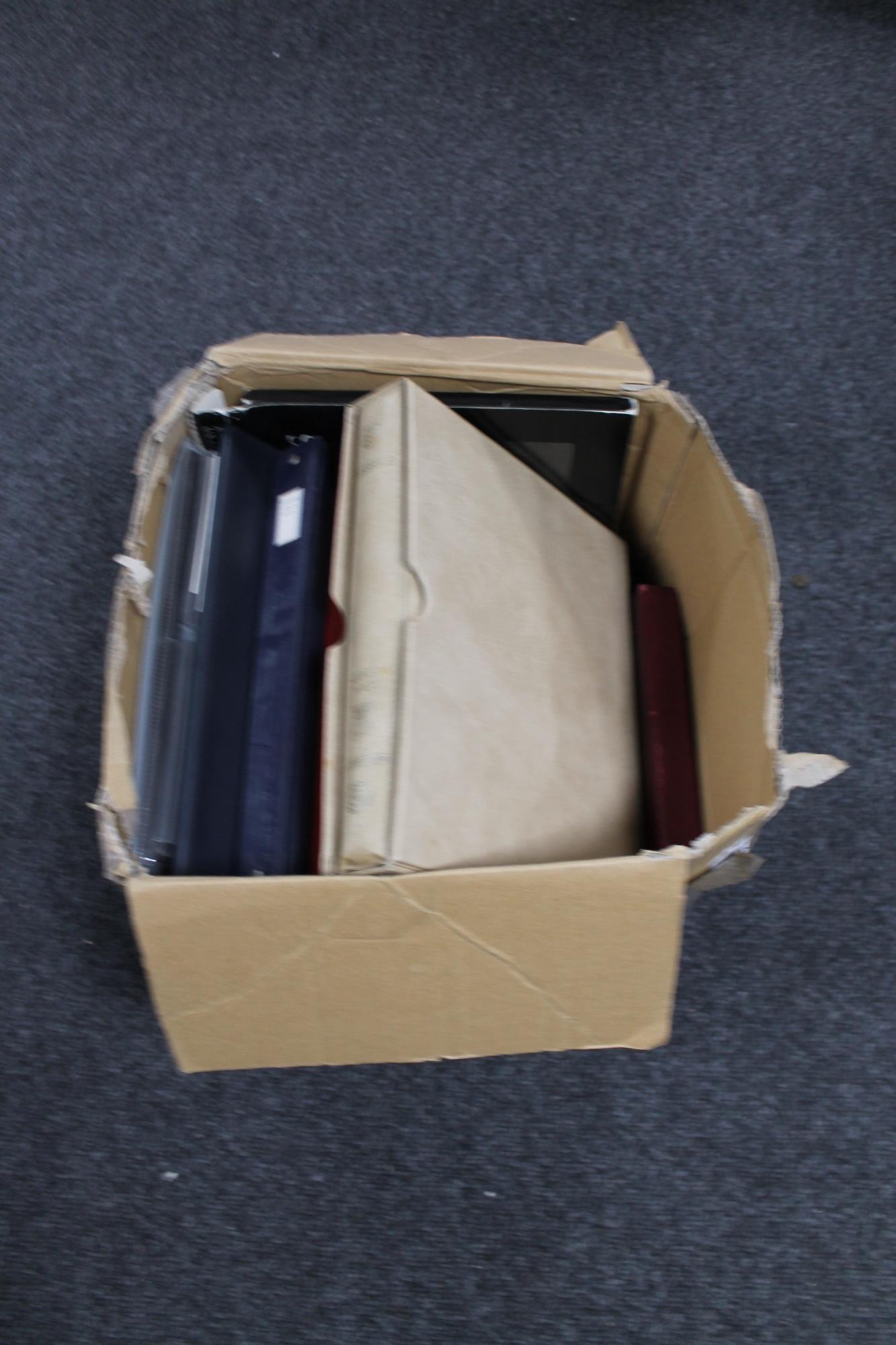 A box of albums and files of first day cover stamps