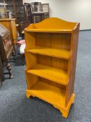 A reproduction yew wood bookcase CONDITION REPORT: 97cm high by 57cm wide by 25cm