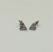 A pair of 14ct white gold diamond set earrings