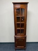 A reproduction corner cabinet