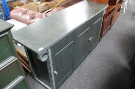 A reproduction three door low sideboard