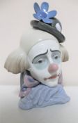 A Lladro clown head figure