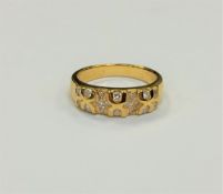 An 18ct gold diamond set ring, size L CONDITION REPORT: 4.