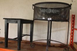 A metal plant stand and a small table.