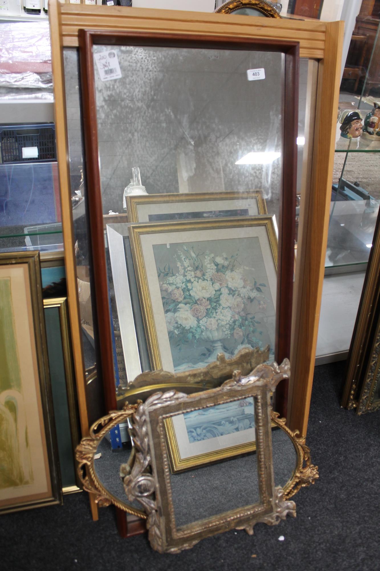 A gilt framed decorative mirror, four further mirrors.