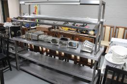 A stainless steel preparation counter with bain marie station