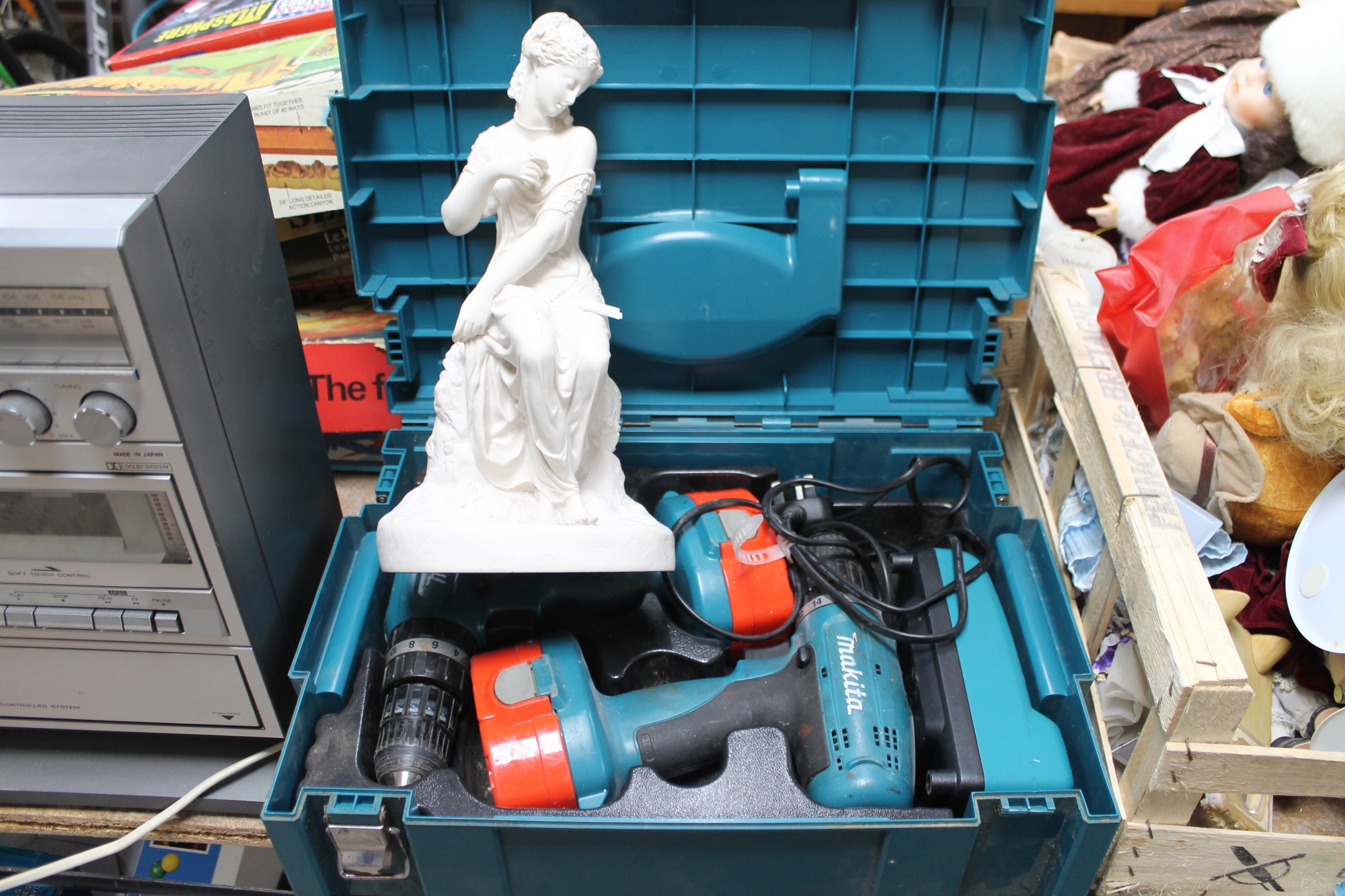 A Makita power drill in case together with a resin ornament (2) CONDITION REPORT: