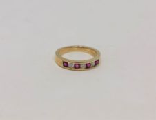 An 18ct gold ruby and diamond ring, size J CONDITION REPORT: 2.