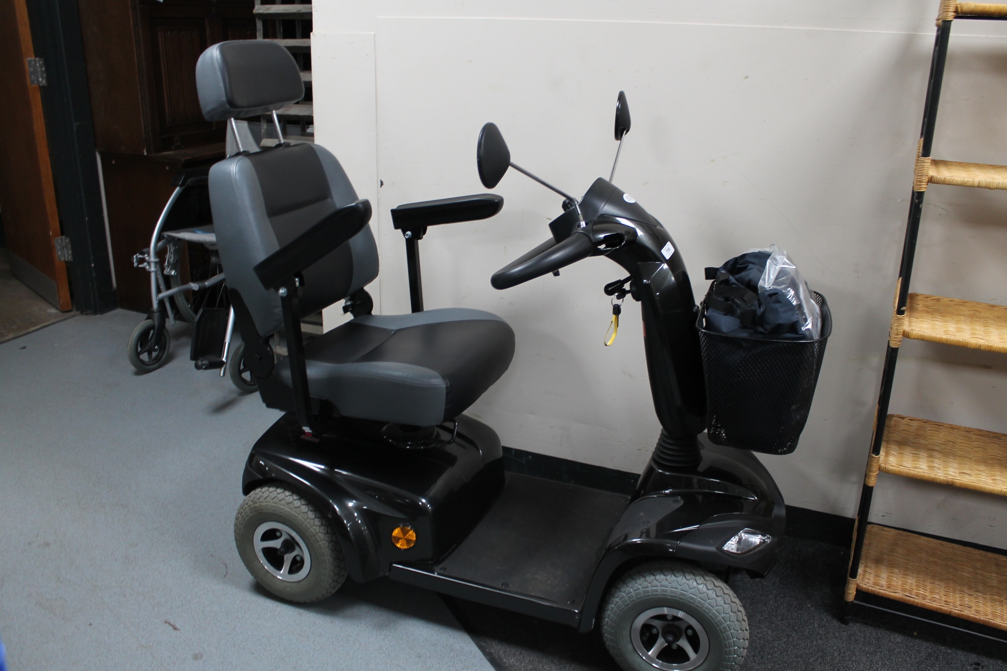 A Strider ST 4E mobility scooter with charger and key