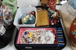 A tray of costume jewellery, religious figure,