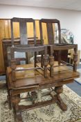 A 1930's carved oak extending dining room table and four chairs CONDITION REPORT: