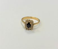 An 18ct gold sapphire and diamond ring