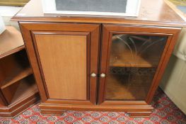 A contemporary corner TV stand with matching audio cabinet