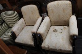 A pair of 19th century mahogany gentleman's armchairs.