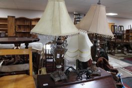 A pair of ornamental table lamps with shades