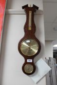 A reproduction oak barometer